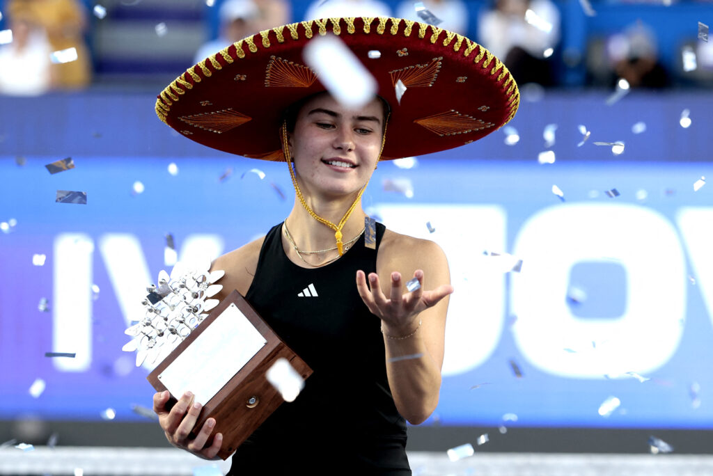 Iva Jovic celebrates with the trophy after winning the women's singles final match of the 2025 WTA Guadalajara Open against Colombia's Emiliana Arango in Zapopan, Mexico.