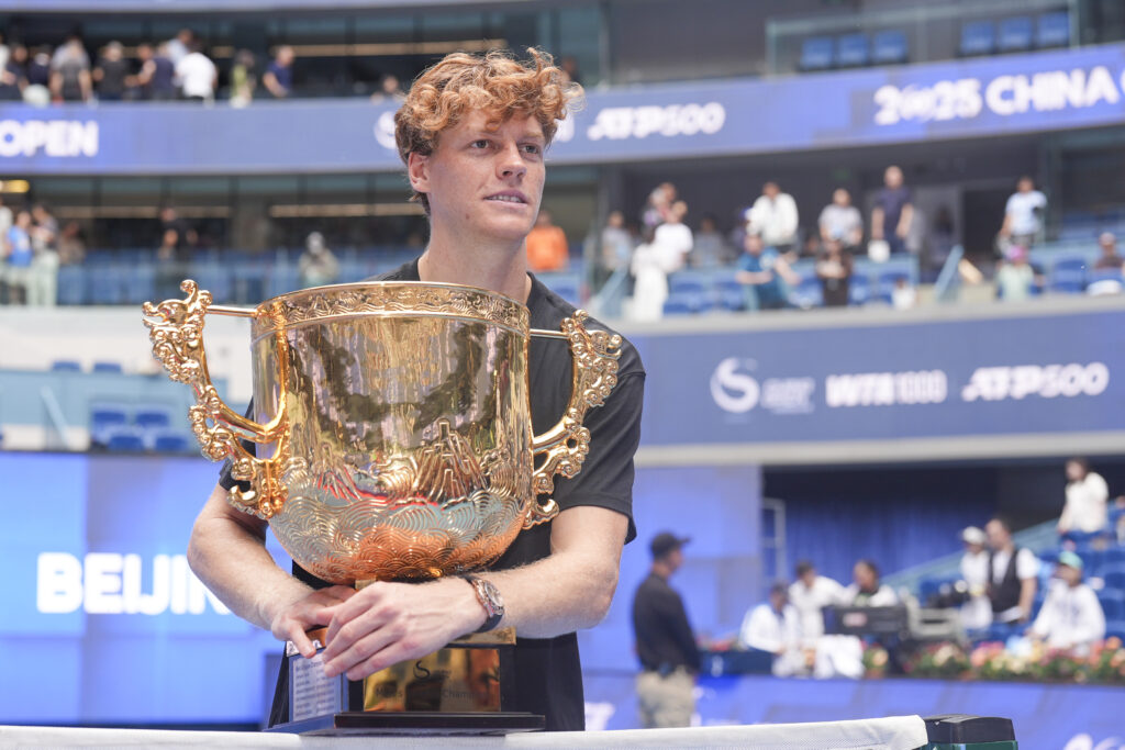 Jannik Sinner of Italy poses with his trophy during the medal ceremony after winning the Men's Singles final match against Learner Tien of the United States on day 10 of 2025 China Open at National Tennis Center.