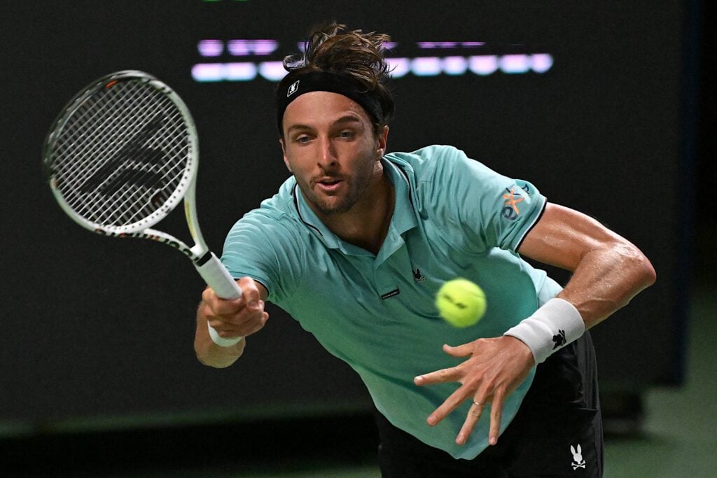 Arthur Rinderknech hits a return to Serbia's Hamad Medjedovic during their men's singles match at the Shanghai Masters tennis tournament.