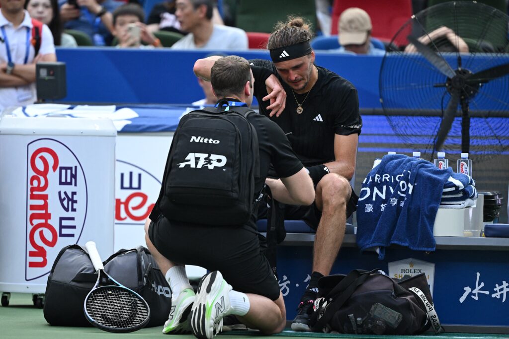 Alexander Zverev receives medical attention at the Shanghai Masters.