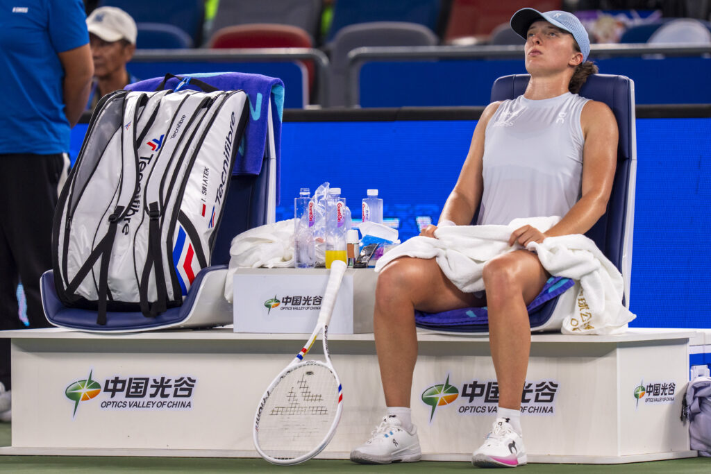 Iga Swiatek reacts in Wuhan.