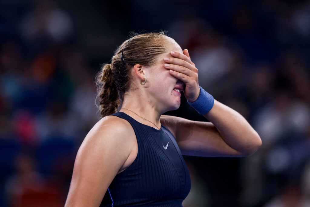 Mirra Andreeva reacts during her defeat to Laura Siegemund at the 2025 Wuhan Open