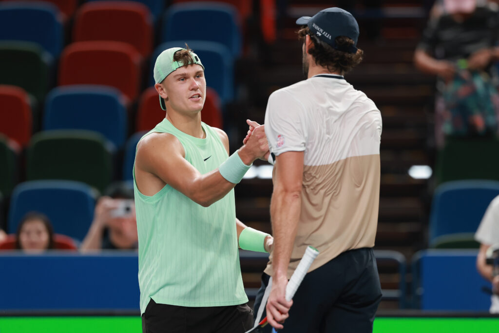 Holger Rune and Valentin Vacherot shake hands after their match at the 2025 Shanghai Masters