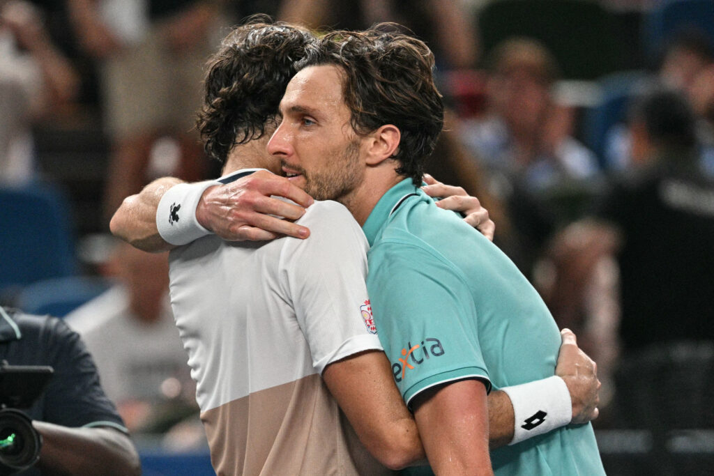 Valentin Vacherot of Monaco and Arthur Rinderknech embrace.