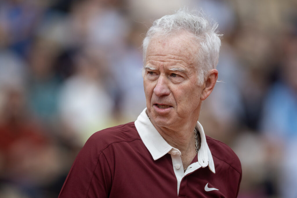 John McEnroe reacts while playing alongside Kim Clijsters at the 2025 French Open