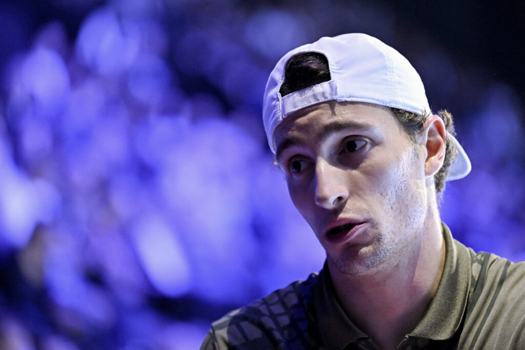 Ugo Humbert reacts before leaving the court after he withdrew from the match due to injury during his men's semi final match against Spain's Alejandro Davidovich Fokina at the Swiss Indoors ATP 500 tennis tournament in Basel.