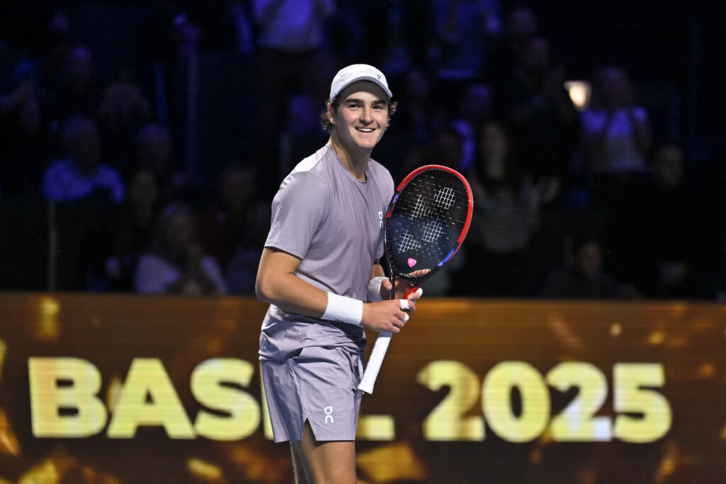 Joao Fonseca smiles after winning the Swiss Indoors in Basel.