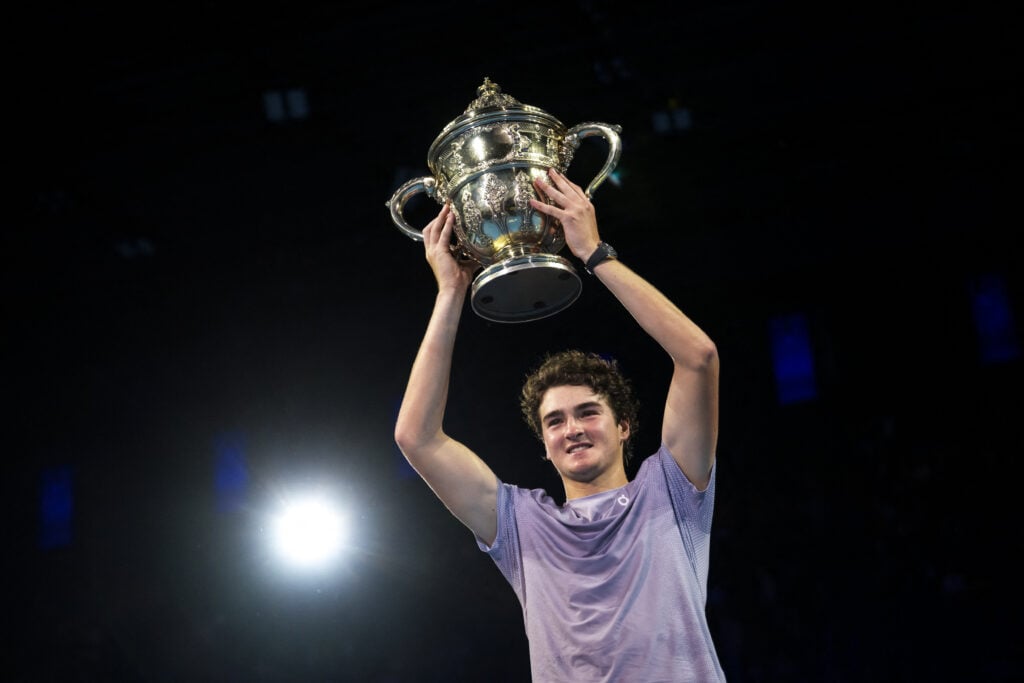 Joao Fonseca hoists the trophy after winning his first ATP 500 title in Basel.