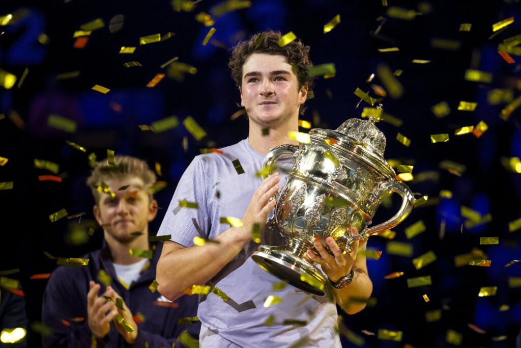 Joao Fonseca poses with the trophy after winning against Spain's Alejandro Davidovich Fokina in their men's final match at the Swiss Indoors ATP 500 tennis tournament in Basel.