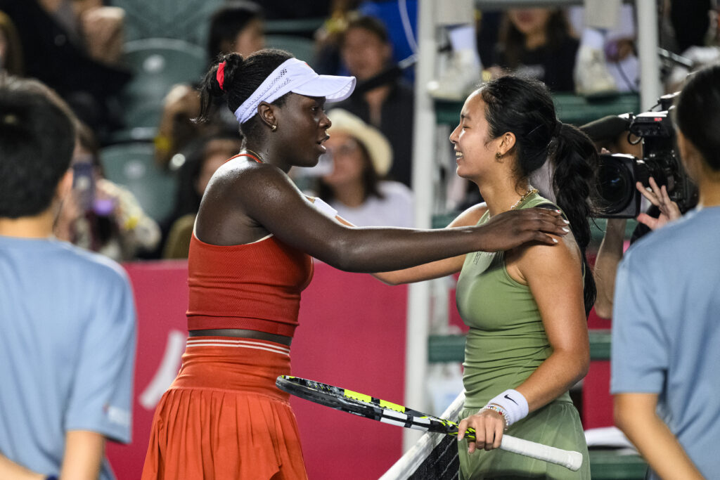 Victoria Mboko and Alexandra Eala embrace at the Hong Kong Tennis Open.
