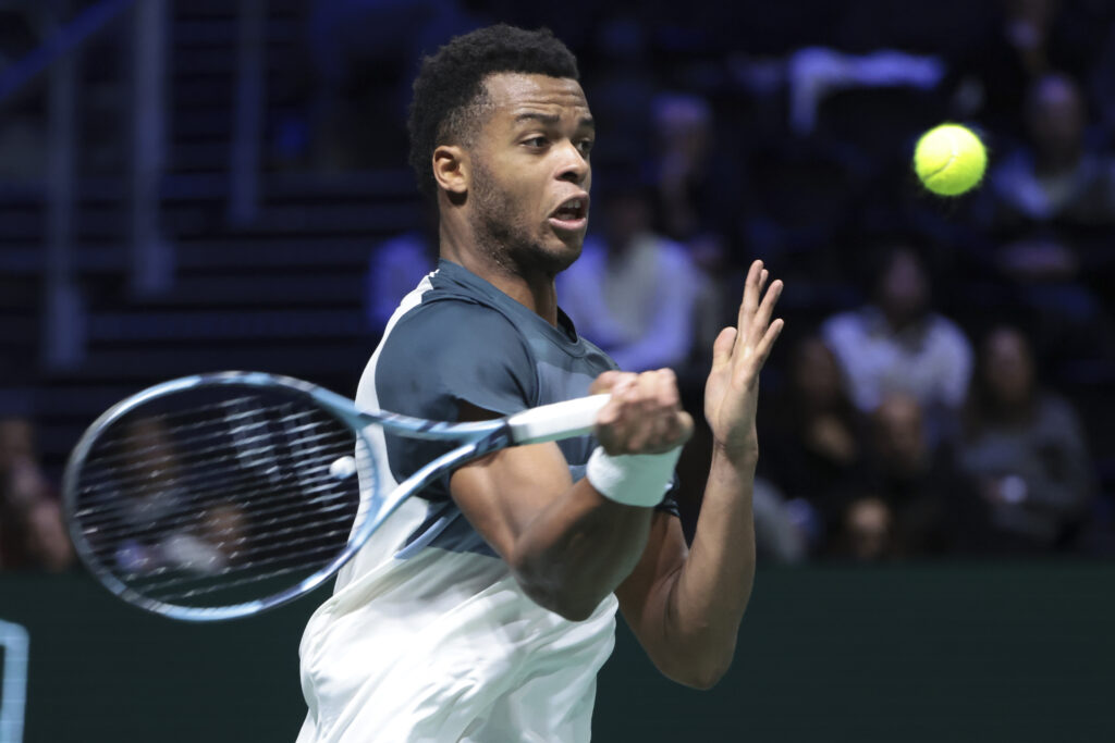Giovanni Mpetshi Perricard hits a forehand against Grigor Dimitrov at the 2025 Paris Masters