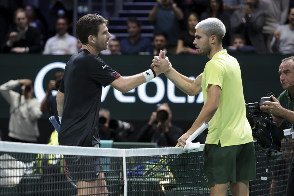 Cameron Norrie and Carlos Alcaraz shake hands after their match at the 2025 Paris Masters