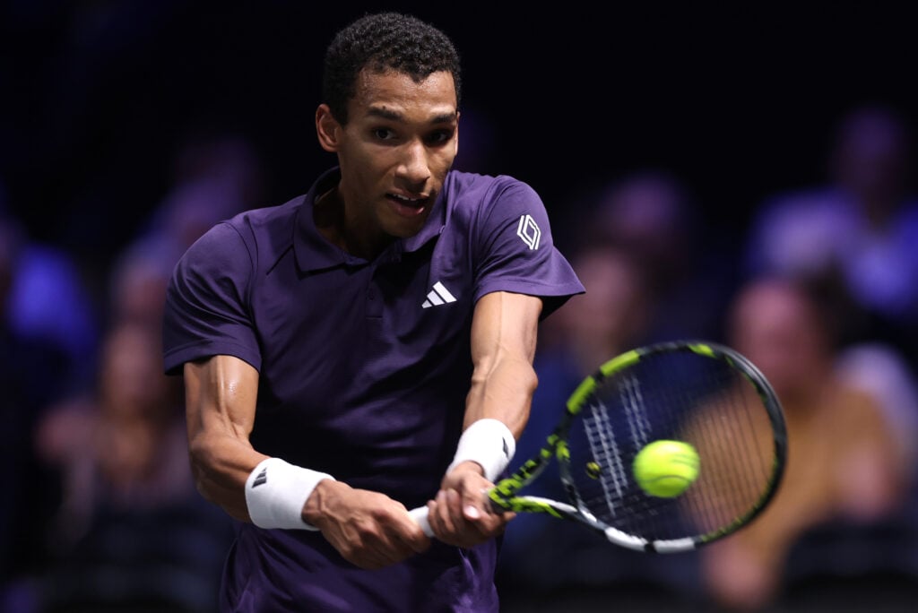 Felix Auger-Aliassime hits a backhand at the 2025 Paris Masters