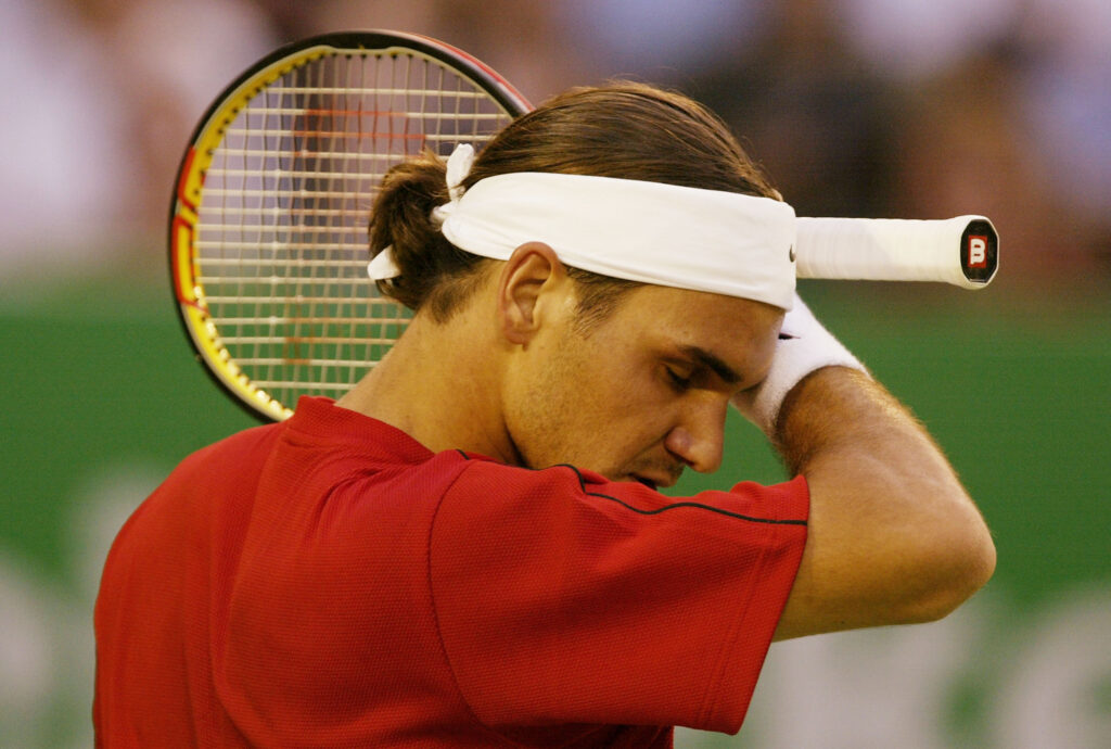 Roger Federer of Switzerland looks dejected during his match against Lleyton Hewitt of Australia during day eight of the Australian Open Grand Slam at Melbourne Park.