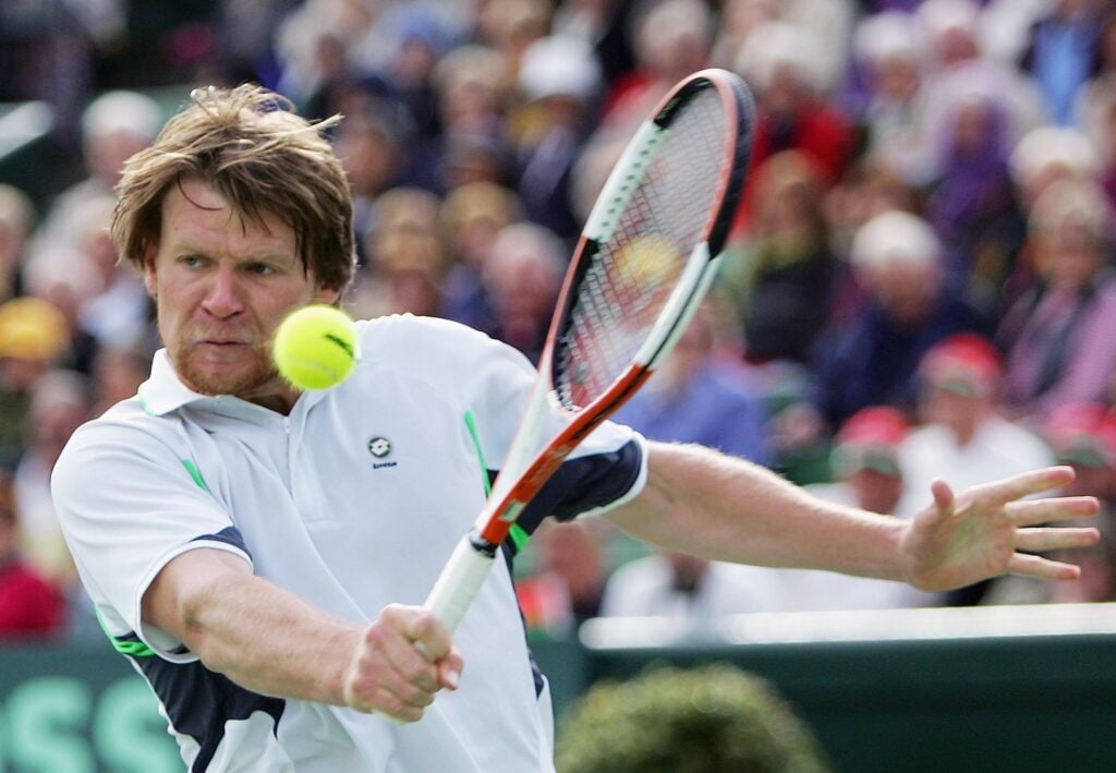 Vladimir Voltchkov hits a backhand to Lleyton Hewitt at the 2006 Davis Cup