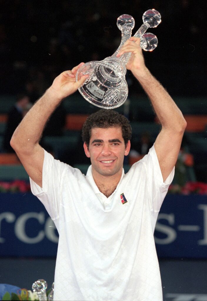 Pete Sampras celebrates with the title after winning the 1999 ATP Finals