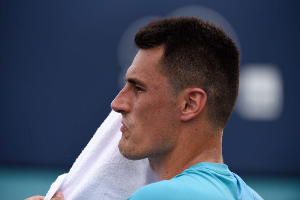 Bernard Tomic looks on at the Miami Open in 2019.