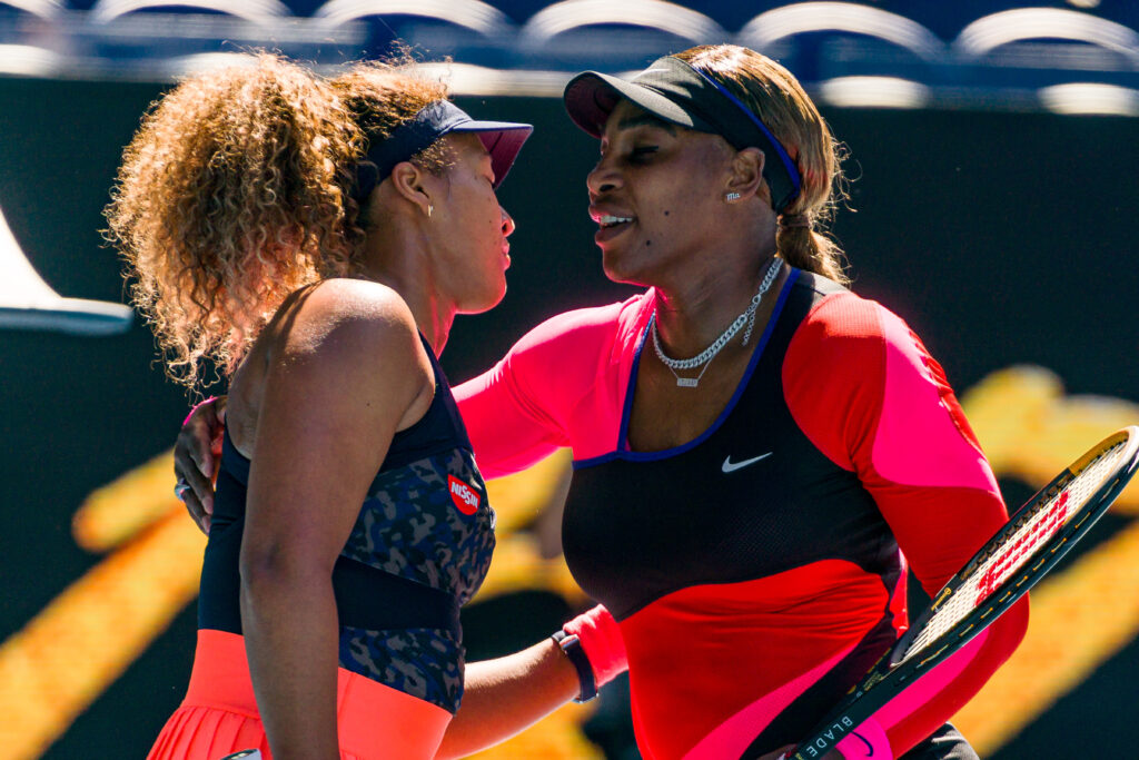 Naomi Osaka and Serena Williams embrace at the 2021 Australian Open.