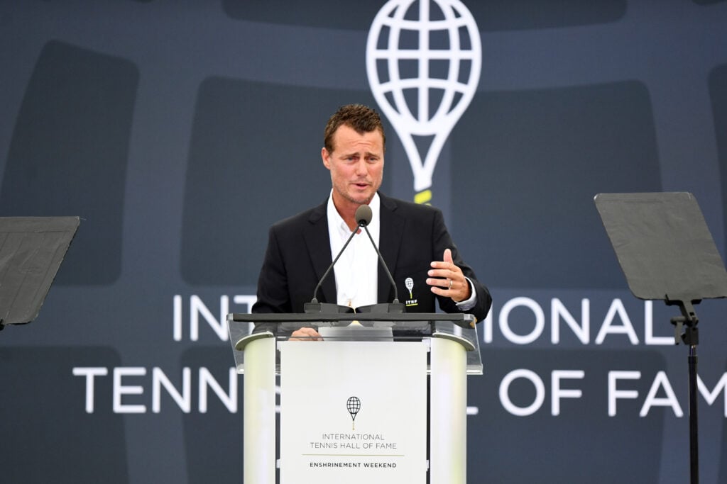 Lleyton Hewitt delivers a speech after being inducted into the International Tennis Hall of Fame in 2022.