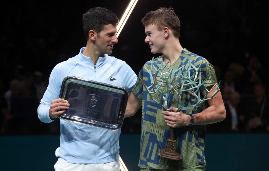 Holger Rune and Novak Djokovic pose together at the 2022 Paris Masters