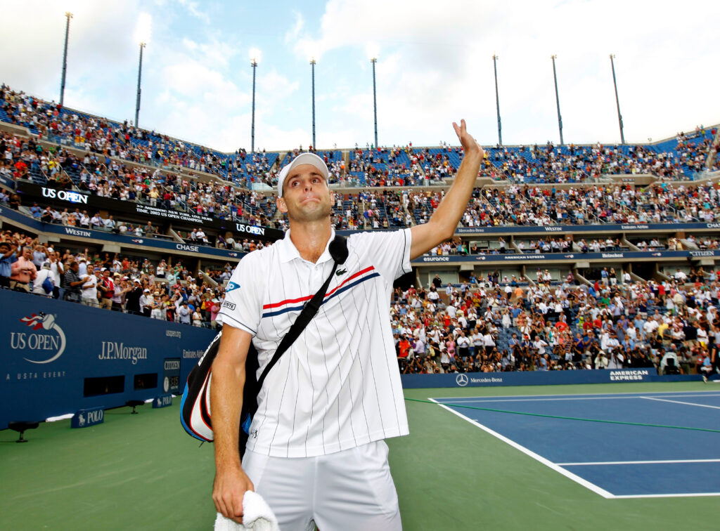 Andy Roddick waves goodbye to the crowd after playing the final match of his career at the 2012 US Open