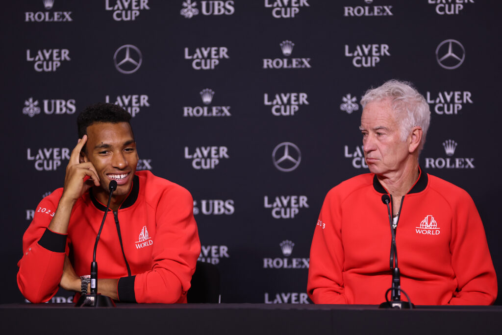 Felix Auger-Aliassime and John McEnroe sit beside one another at a Laver Cup press conference