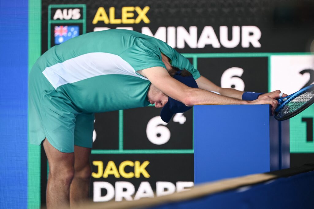 Jack Draper of Britain doubles over near exhaustion
