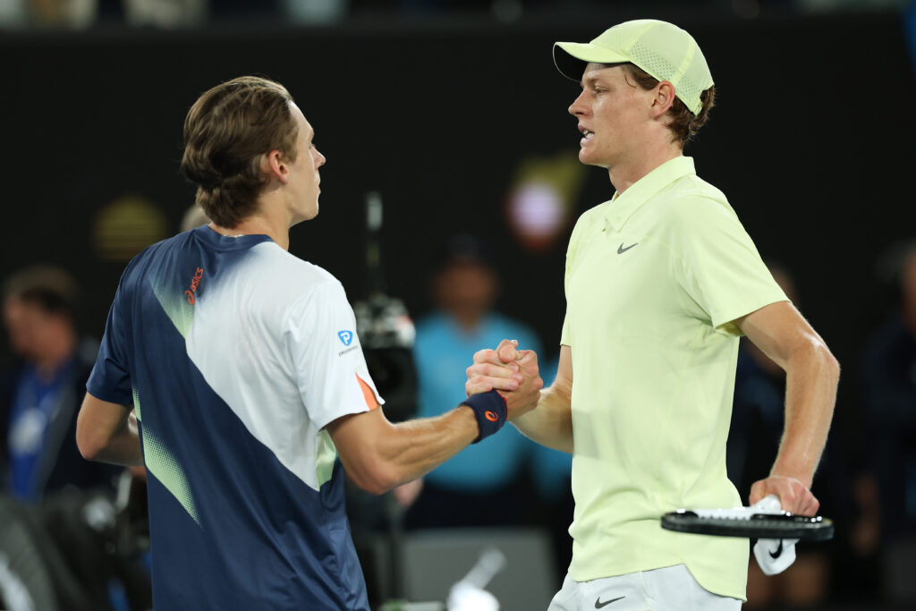 Alex de Minaur and Jannik Sinner shake hands at the net