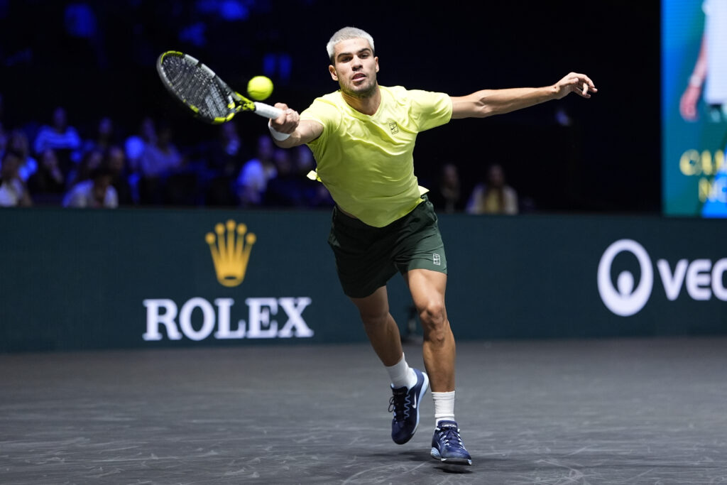Carlos Alcaraz reaches for a forehand during his match against Cameron Norrie at the 2025 Paris Masters.