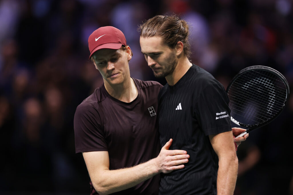 Jannik Sinner and Alexander Zverev embrace at the net after their semifinal match at the 2025 Paris Masters.
