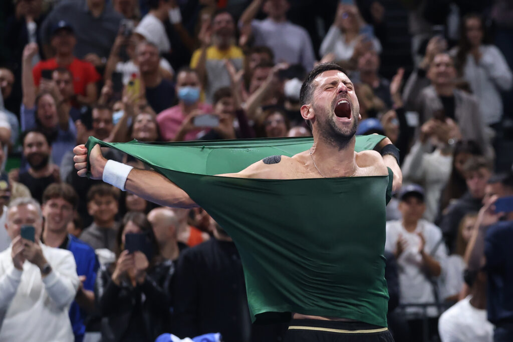Novak Djokovic rips open his shirt
