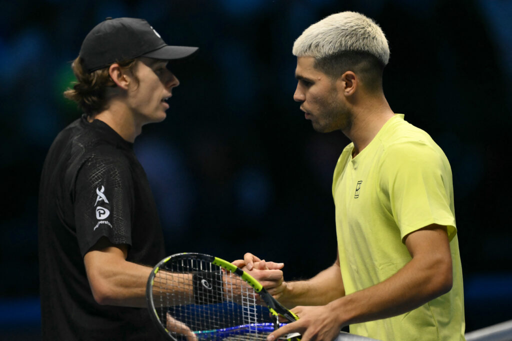 Carlos Alcaraz shakes hands with Alex de Minaur after beating him at the 2025 ATP Finals in Turin.