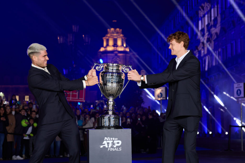 Carlos Alcaraz and Jannik Sinner wrestle with the ATP World number one trophy in 2025
