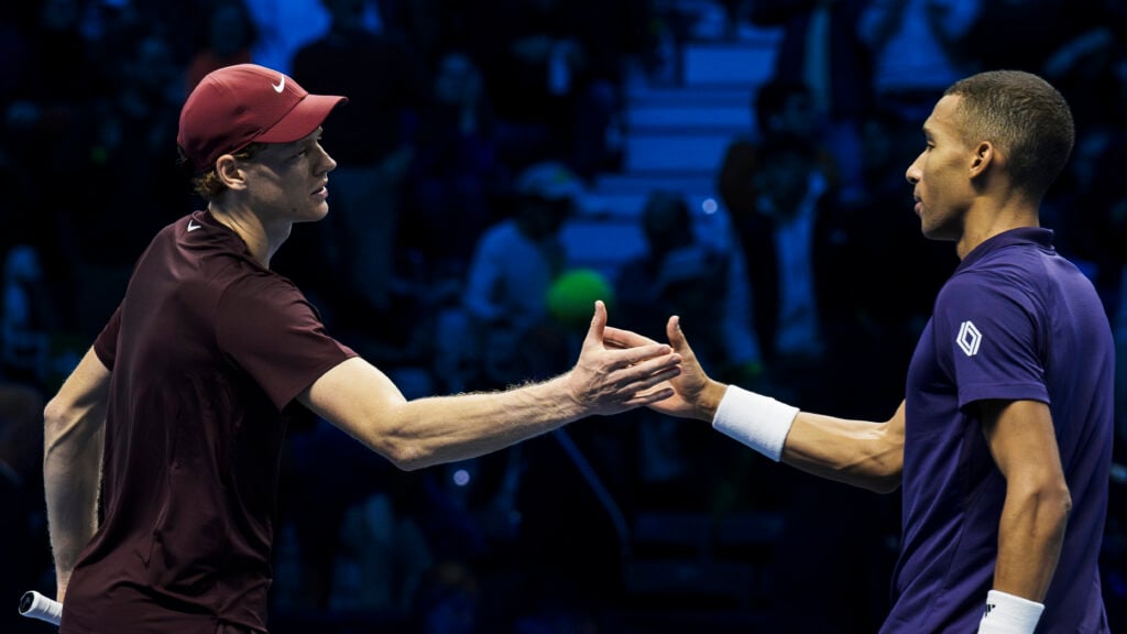 Jannik Sinner shakes hands with Felix Auger-Aliassime after beating him at the 2025 ATP Finals in Turin.