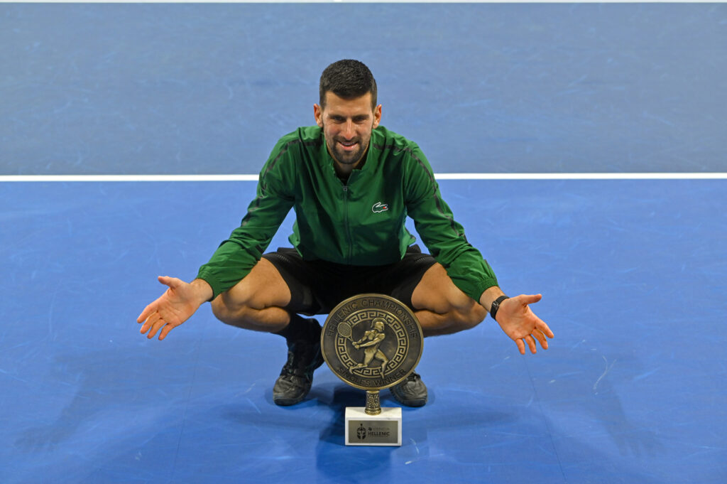 Novak Djokovic poses with the trophy in Greece