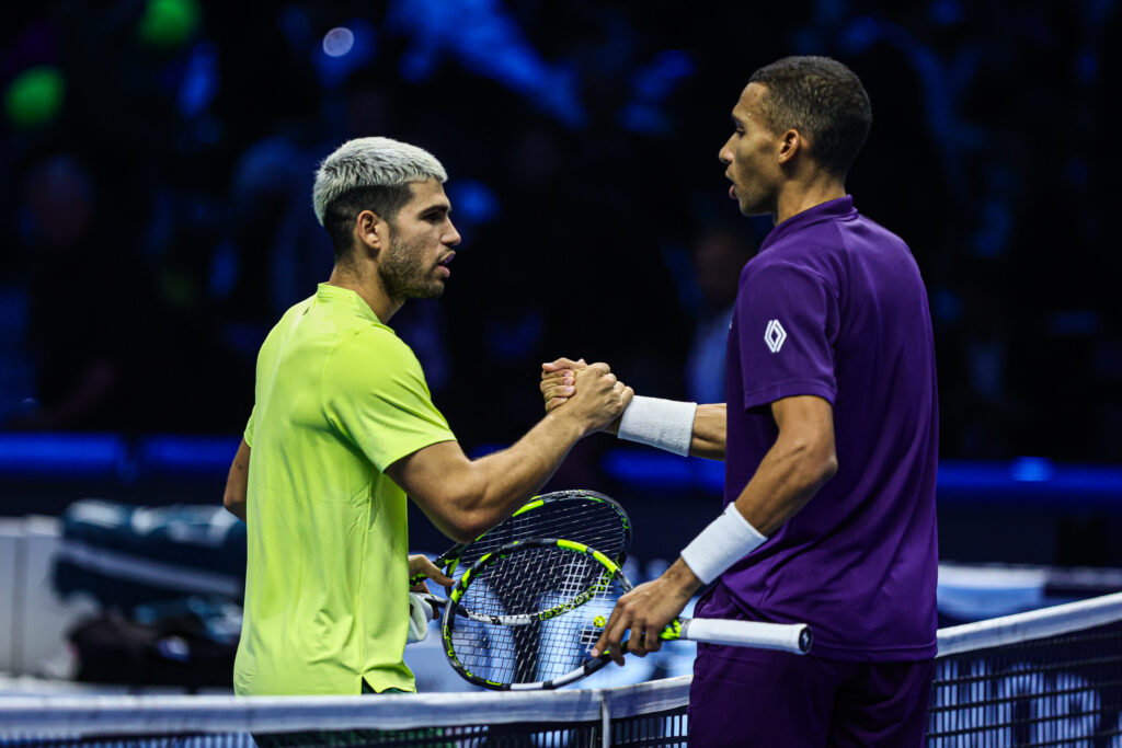Carlos Alcaraz shakes hands with Felix Auger-Aliassime after beating him at the 2025 ATP Finals in Turin.