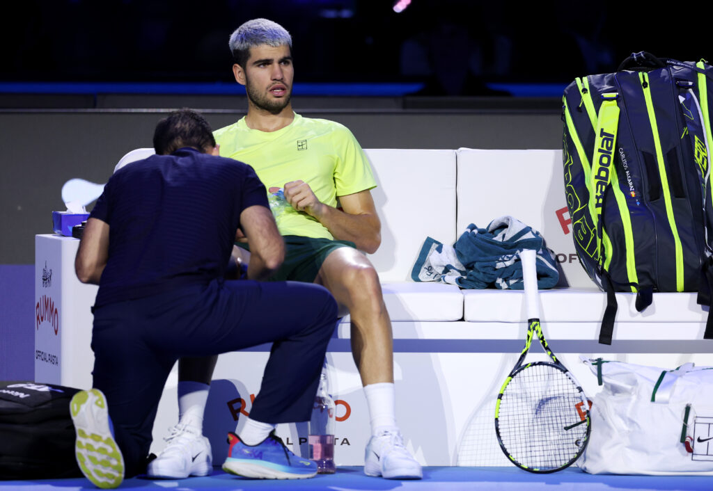 Carlos Alcaraz receives medical treatment during the 2025 ATP Finals