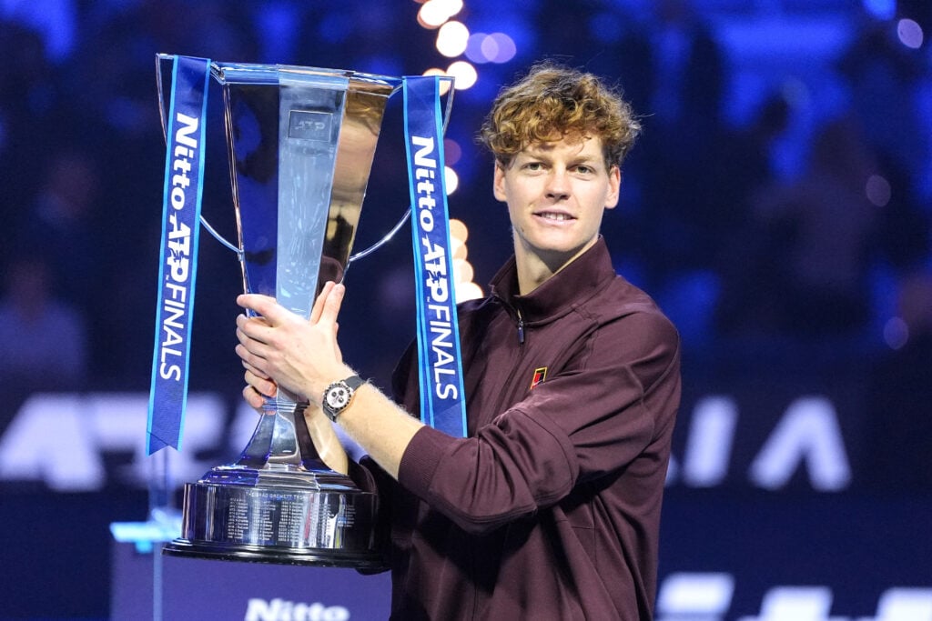Jannik Sinner poses with the trophy after winning the 2025 ATP Finals in Turin.
