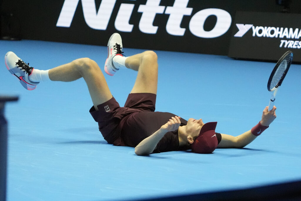Jannik Sinner celebrates after beating Carlos Alcaraz at the 2025 ATP Finals in Turin.