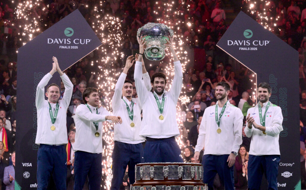 Matteo Berrettini lifting the Davis Cup trophy with his Italian teammates after beating Spain in the 2025 final in Bologna.