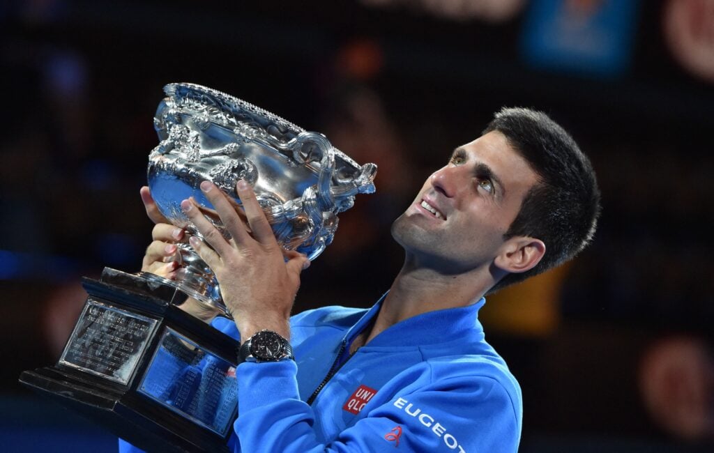 Novak Djokovic holding the 2015 Australian Open title.