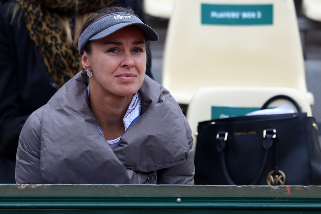 Martina Hingis of Switzerland watches the Ladies Singles fourth round match between Kiki Bertens of Netherlands and Madison Keys of the United States on day eleven of the 2016 French Open.