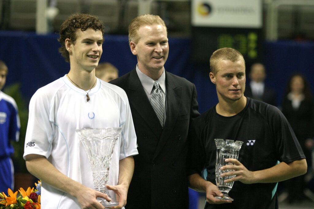 Andy Murray and Lleyton Hewitt pose with their trophies after the 2006 SAP Open final