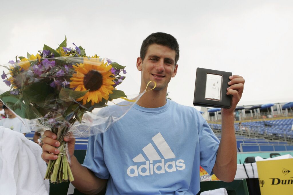 Novak Djokovic celebrates after winning his first ATP title at the Dutch Open in 2006.