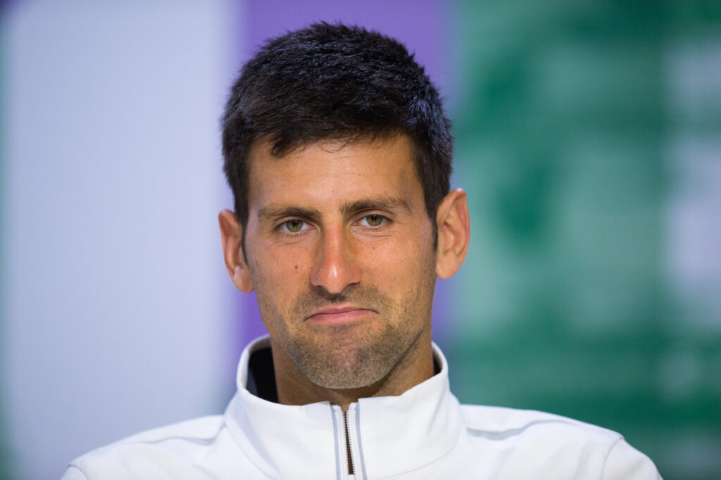 Novak Djokovic reacts during a press conference at Wimbledon in 2017