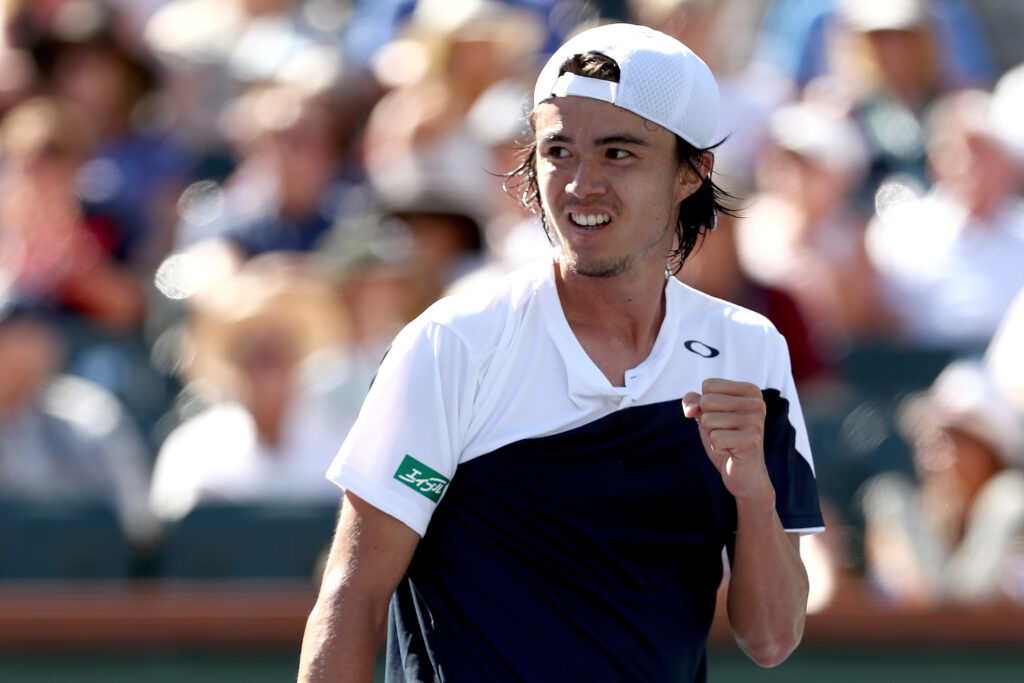 Taro Daniel celebrates in his match against Novak Djokovic at Indian Wells in 2018.