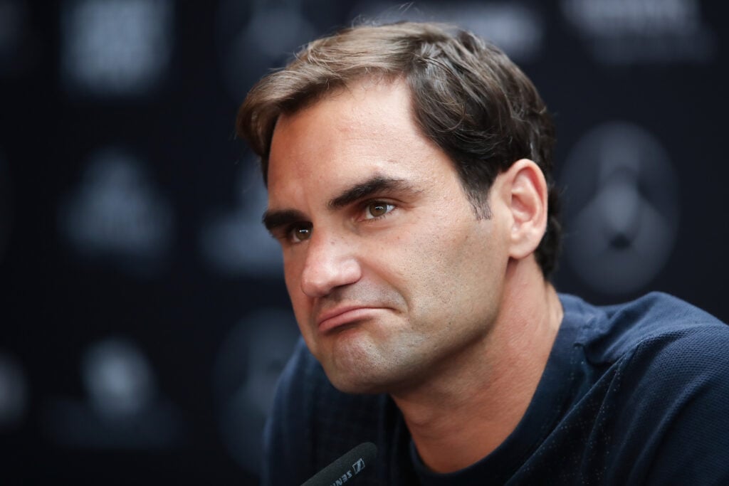 Roger Federer looks on during a press conference in 2018
