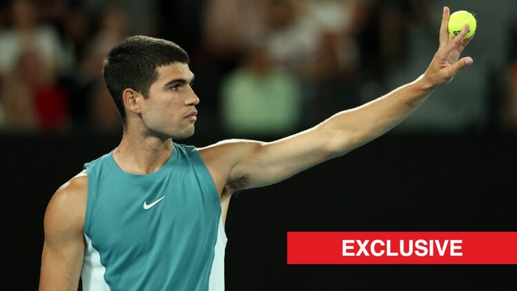Carlos Alcaraz holds out a ball, exclusive logo bottom right
