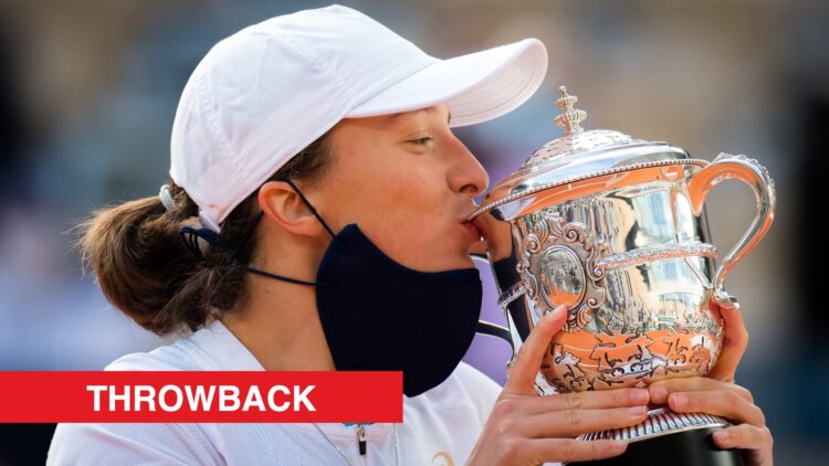 Iga Swiatek kissing the 2020 French Open title, with a throwback label.