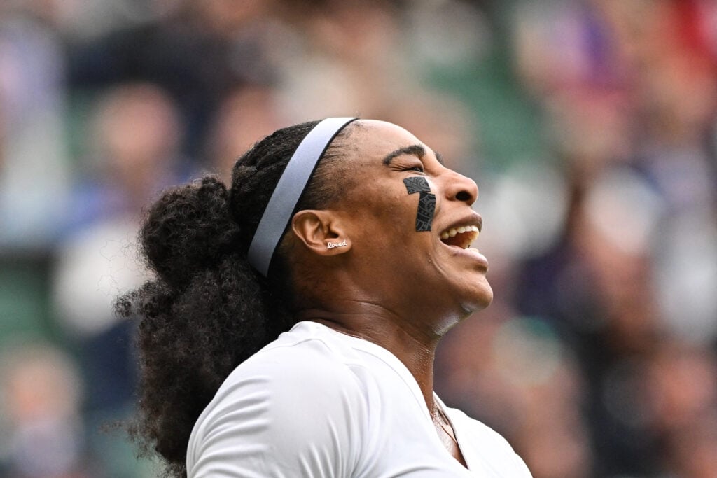 Serena Williams reacts during her first-round defeat at Wimbledon in 2022
